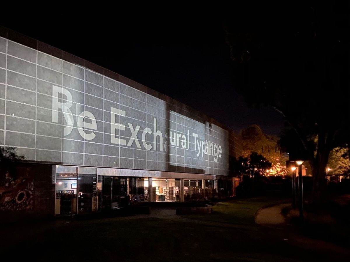 A projection on the side of a large building