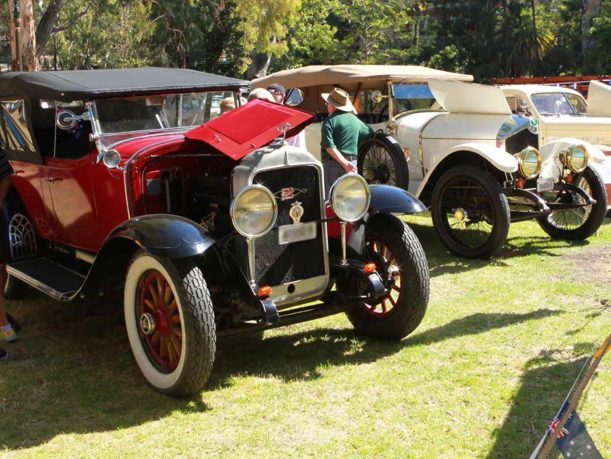 two old cars on display