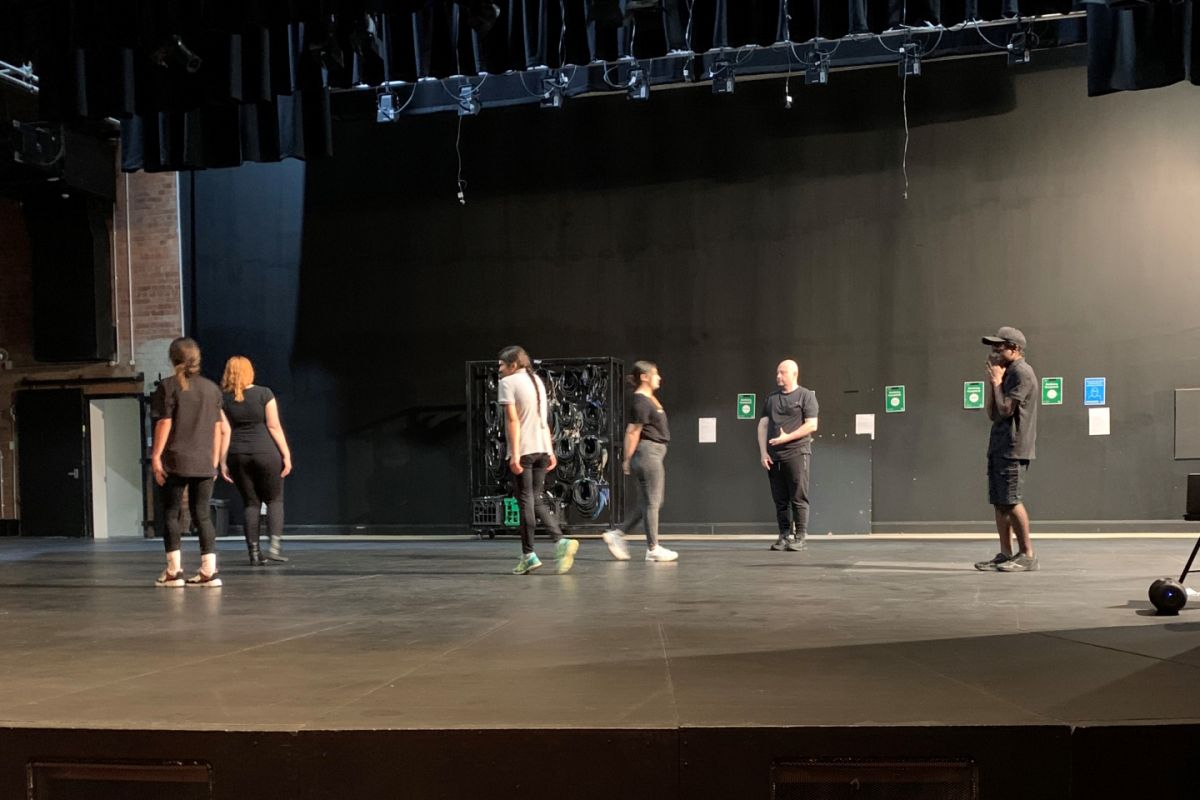 Young males and females from multicultural communities on theatre stage