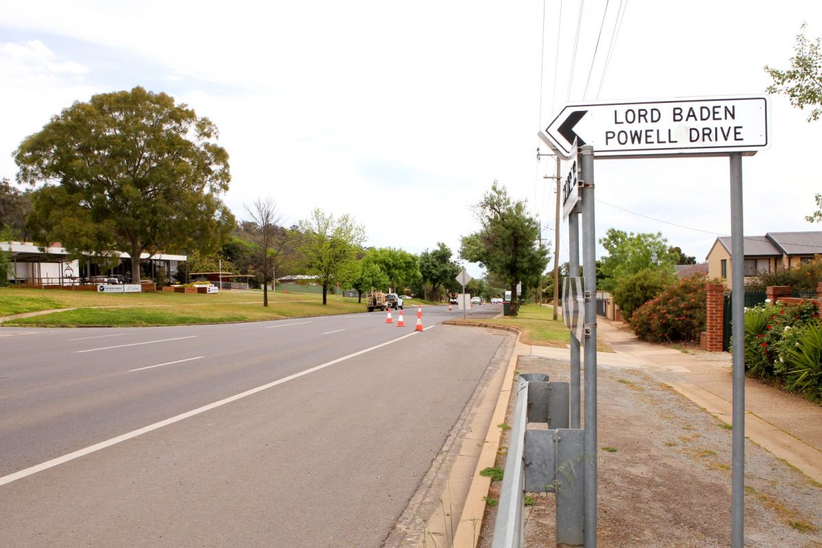 Street sign and road with one lane close in background