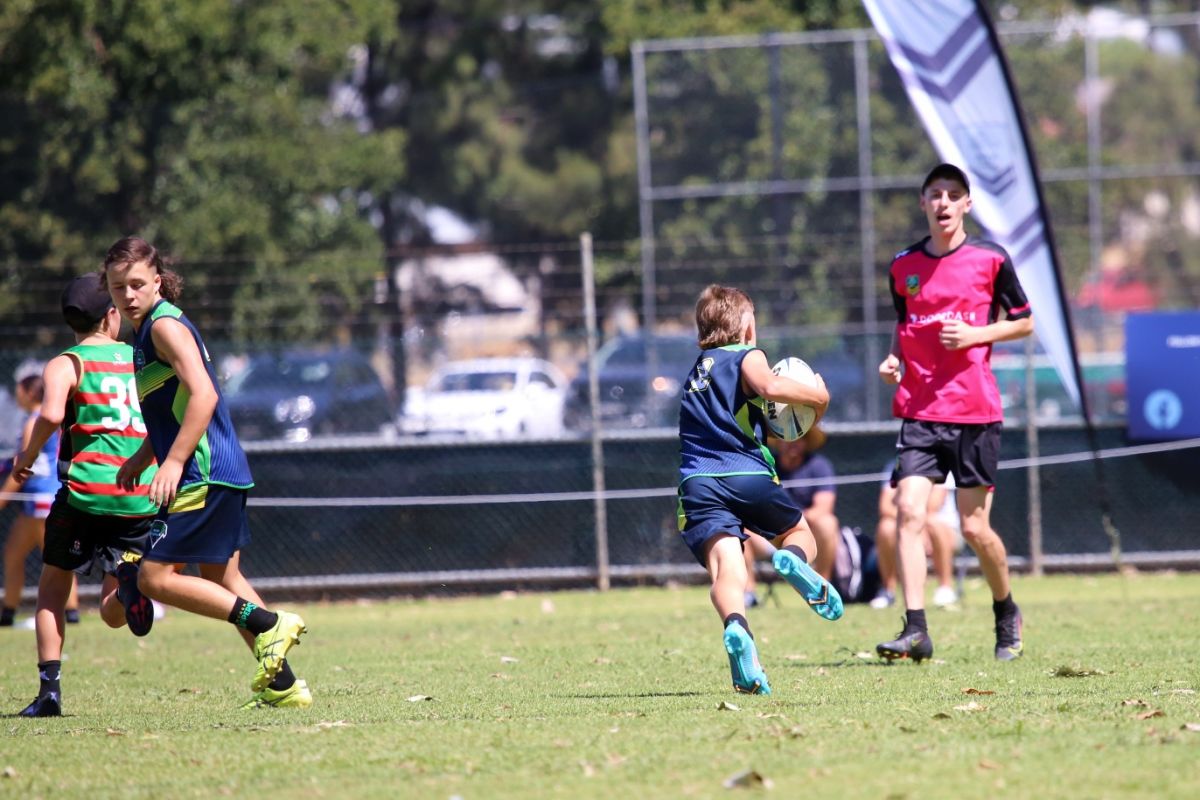 Back view of U14s Wagga Vipers player heading to touch line