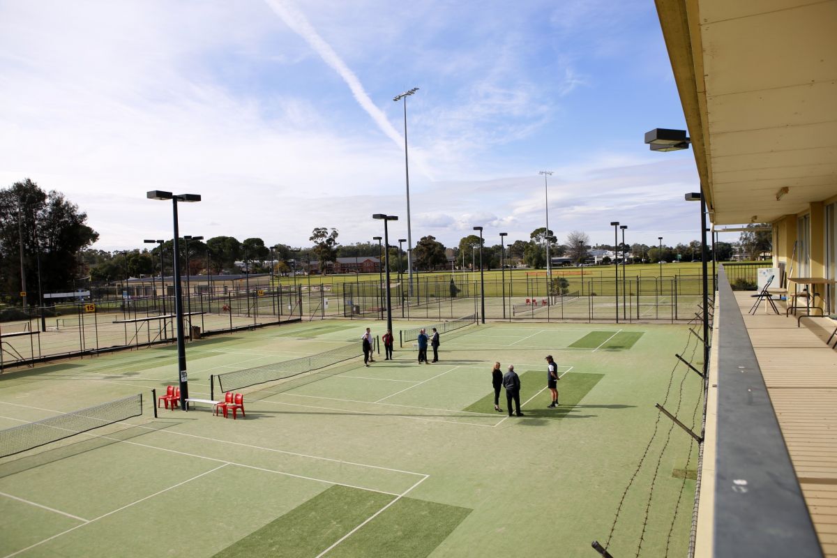 Tennis courts shot from balcony of building