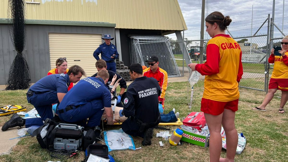 Paramedics and lifeguards and swimming teachers in action during an intensive water rescue and resuscitation simulation