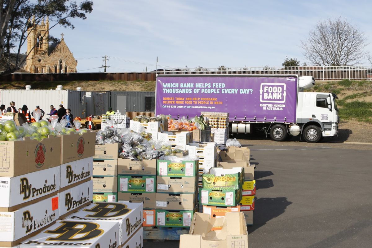 A large truck and several large crates of food.