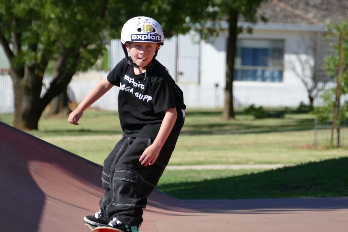 A young child on a skateboard.