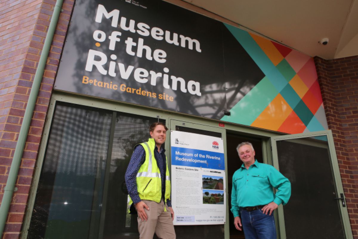 Two people standing in front of building