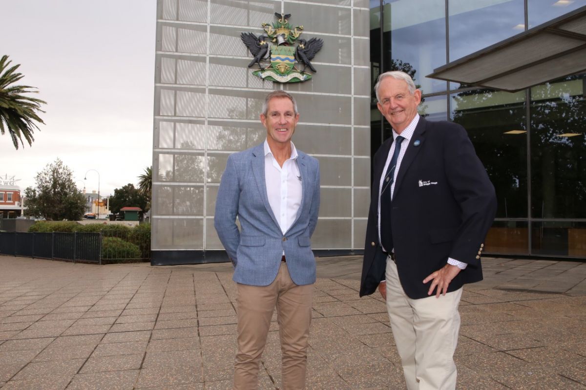 Two men outside civic centre