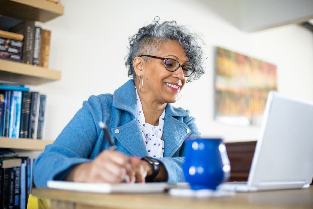 Woman looking at laptop