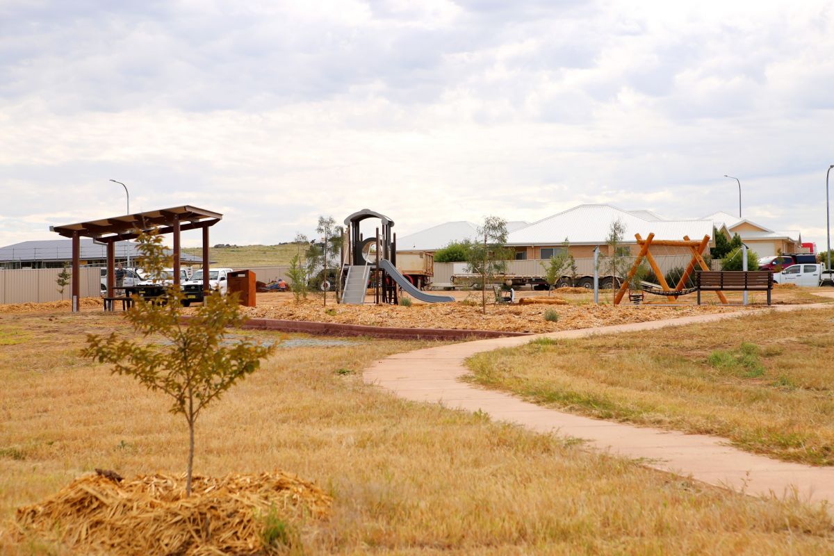 Wide shot of recently built playground with shelter