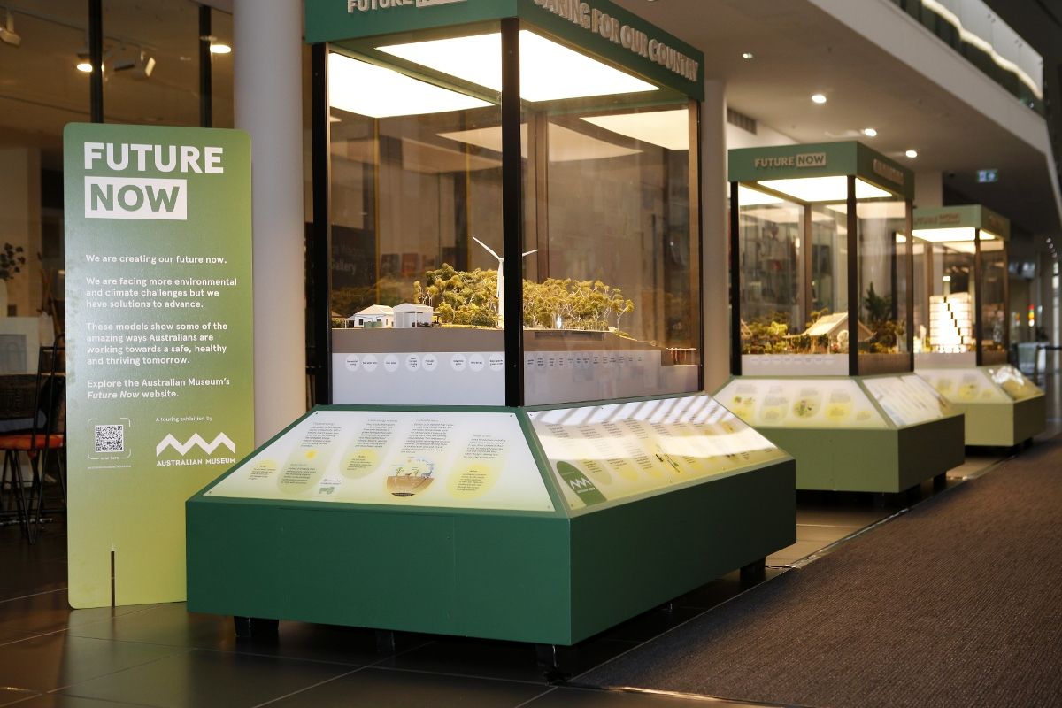 Free standing pods featuring dioramas of rural, urban and coastal liviing with Future Now exhibition sign in arcade of Civic Centre in Wagga
