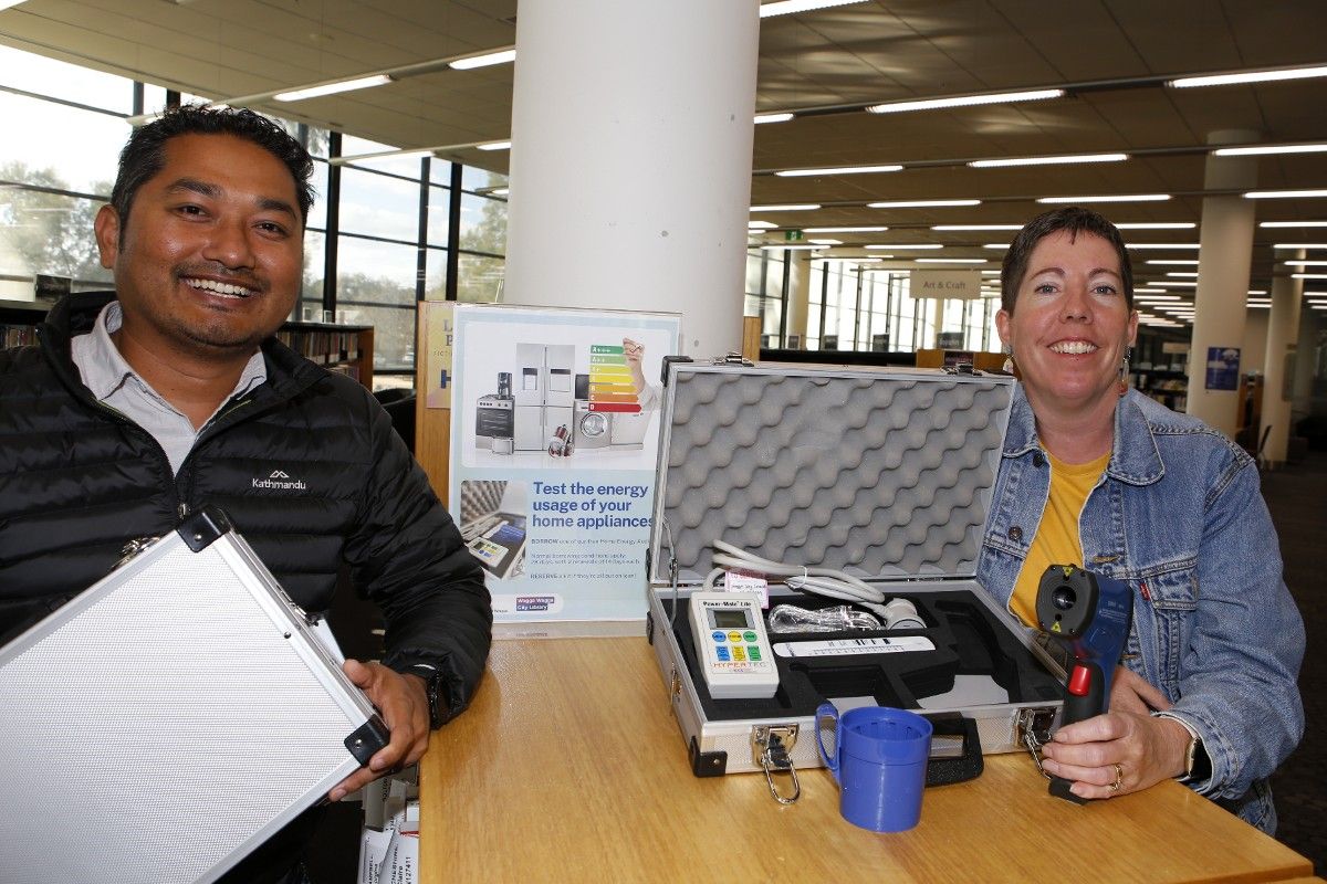 Hemendra Chaudhary and Wendy Harper with Home Energy Efficiency Kit