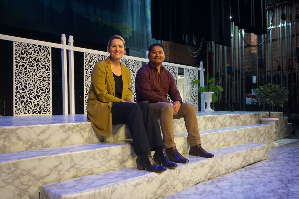 Net Zero Emissions Project Officer Hemendra Chaudhary and Manager Civic Theatre Claire Harris on stage with theatre in b/g, under spotlight