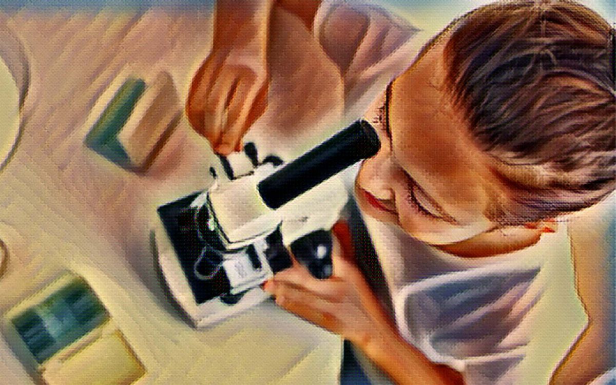 kid looking in microscope