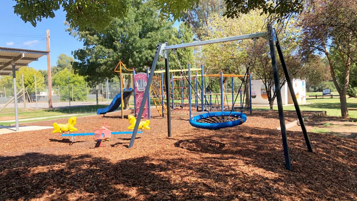 Playground with bridge and play equipment