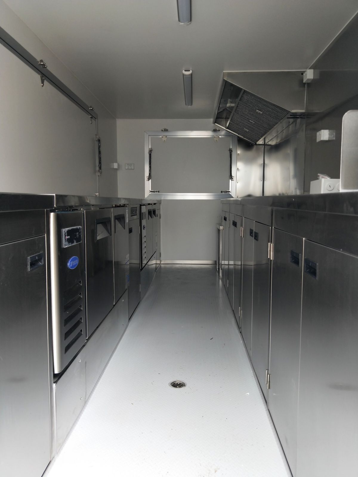 Kitchen galley with stainless steel cabinets inside food van