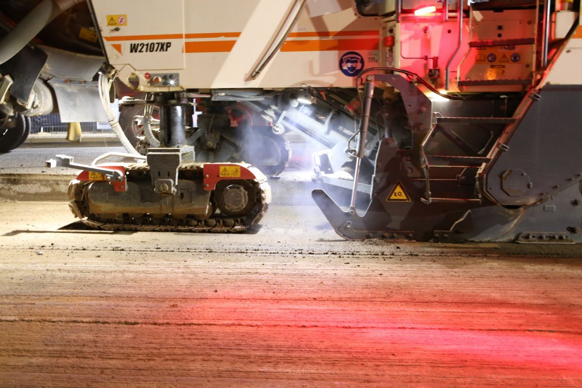 milling machine cutting into road surface 