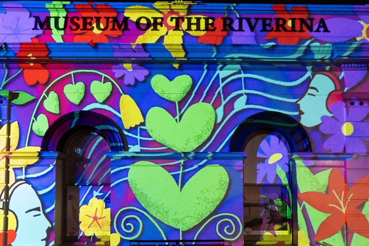 A light art projection on an exterior wall of a building. 