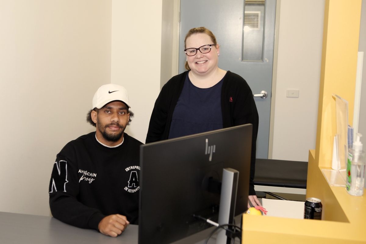 Young First Nations tech helper Caleb Atkinson with Library Services Team Leader Jeannie Hazell at Tolland Community Centre for Tech Help for First Nation seniors