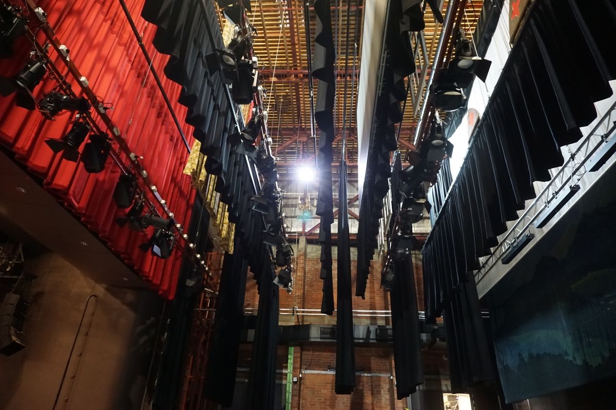 Racks of theatre lights above stage at Civic Theatre.