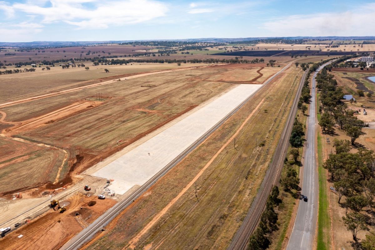 Aerial of paved area beside rail siding