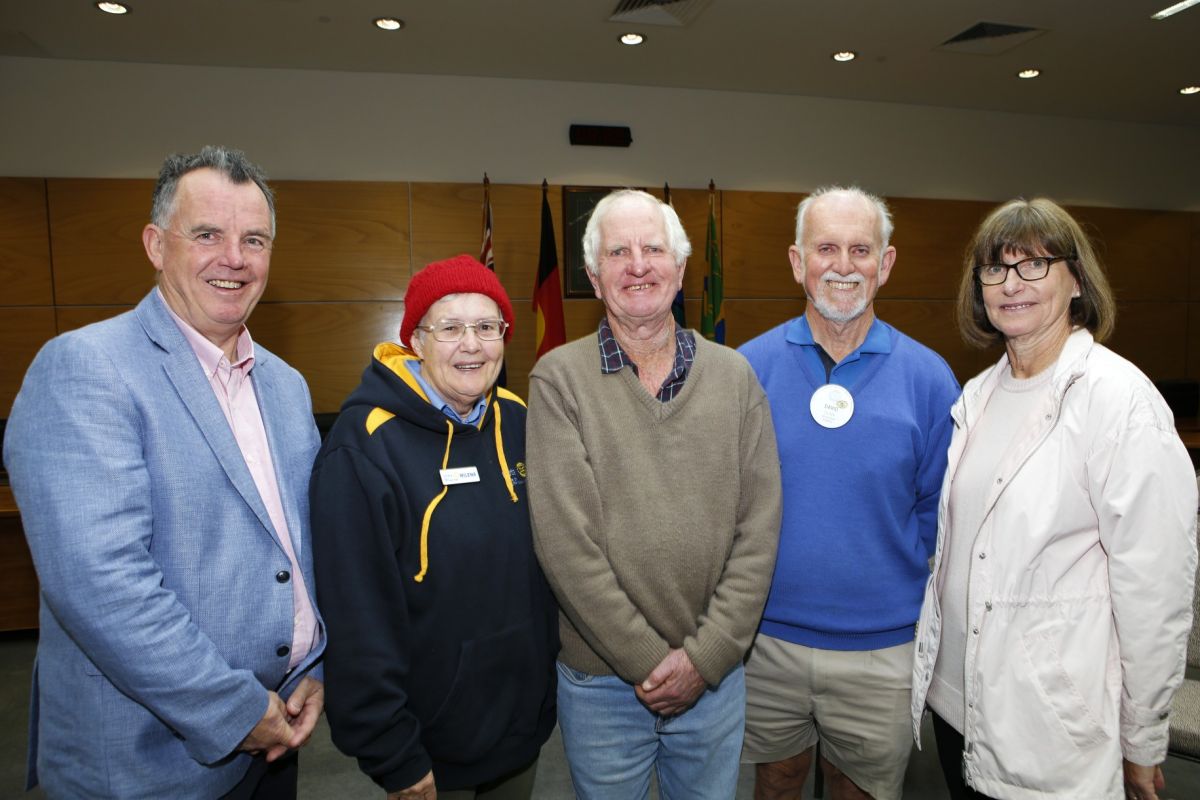 three men and two women standing in council chambers