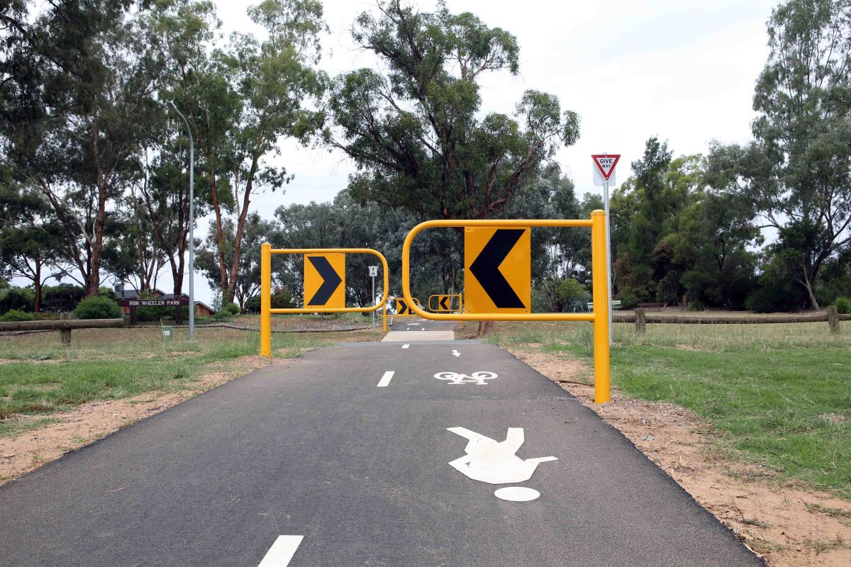 Shared pathway approach to road, with access gates 