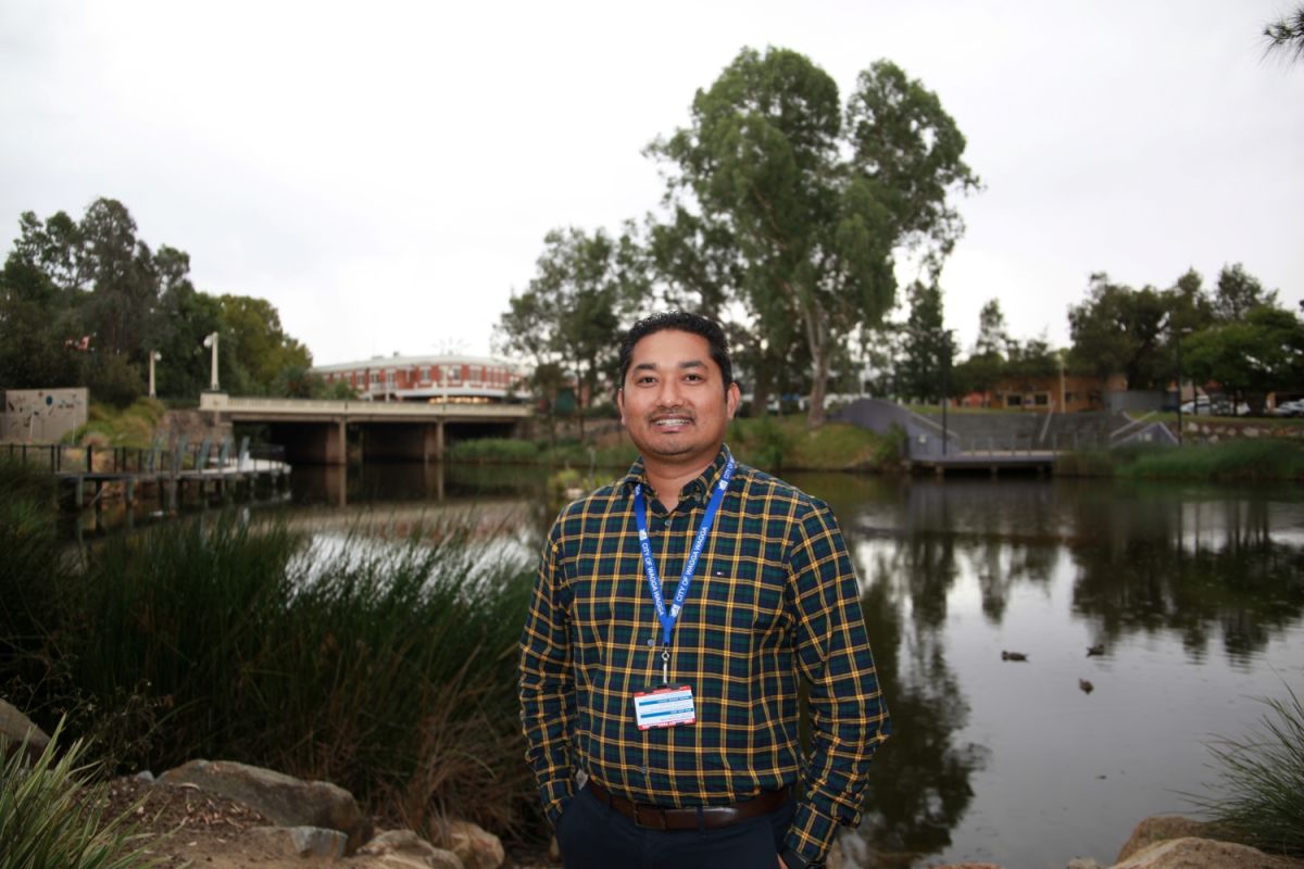Net Zero Emissions Project Officer Hemendra Chaudhary in front of the Wollundry Lagoon in Wagga Wagga.