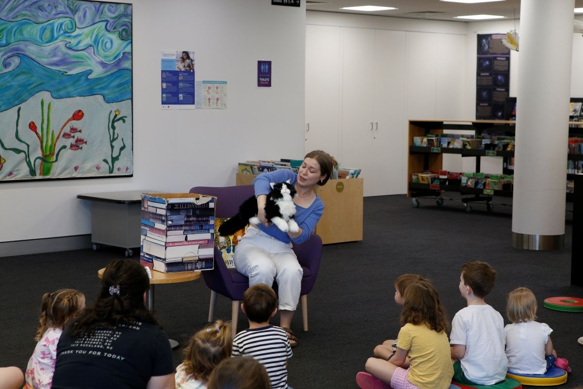 Senior Library Programs Office Catherine Greenslade introduces one of the Library’s new robotic cats to a Storytime audience on Friday 7 March.