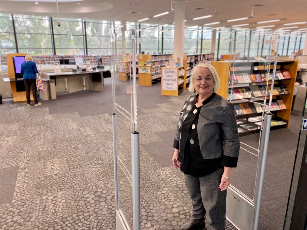 Woman standing in entrance to library