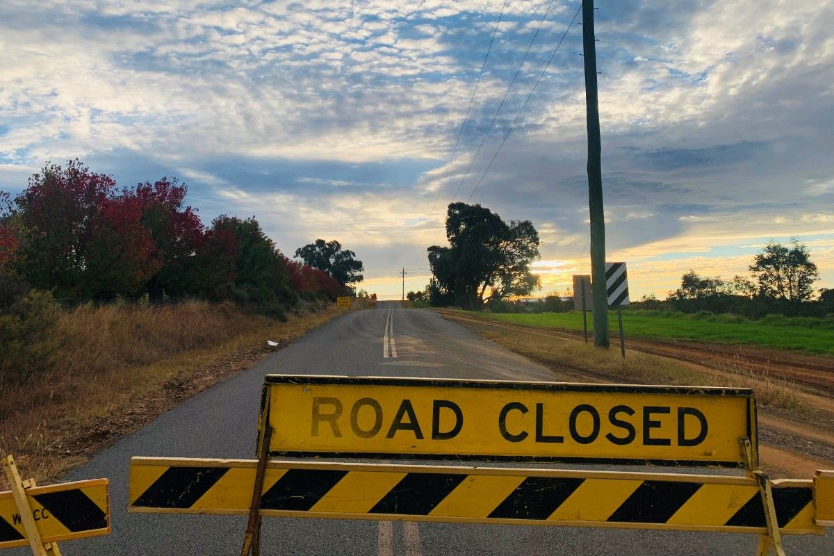 Road closed sign on road