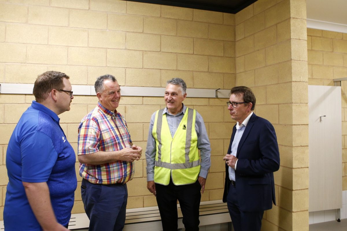 (From left) Tolland Wolves Club President Josh Lang, Wagga Wagga Mayor Cr Dallas Tout, Council Project Manager Luke Fitzgerald, and Member for Wagga Wagga Dr Joe McGirr MP standing inside an upgraded brick sporting changeroom.