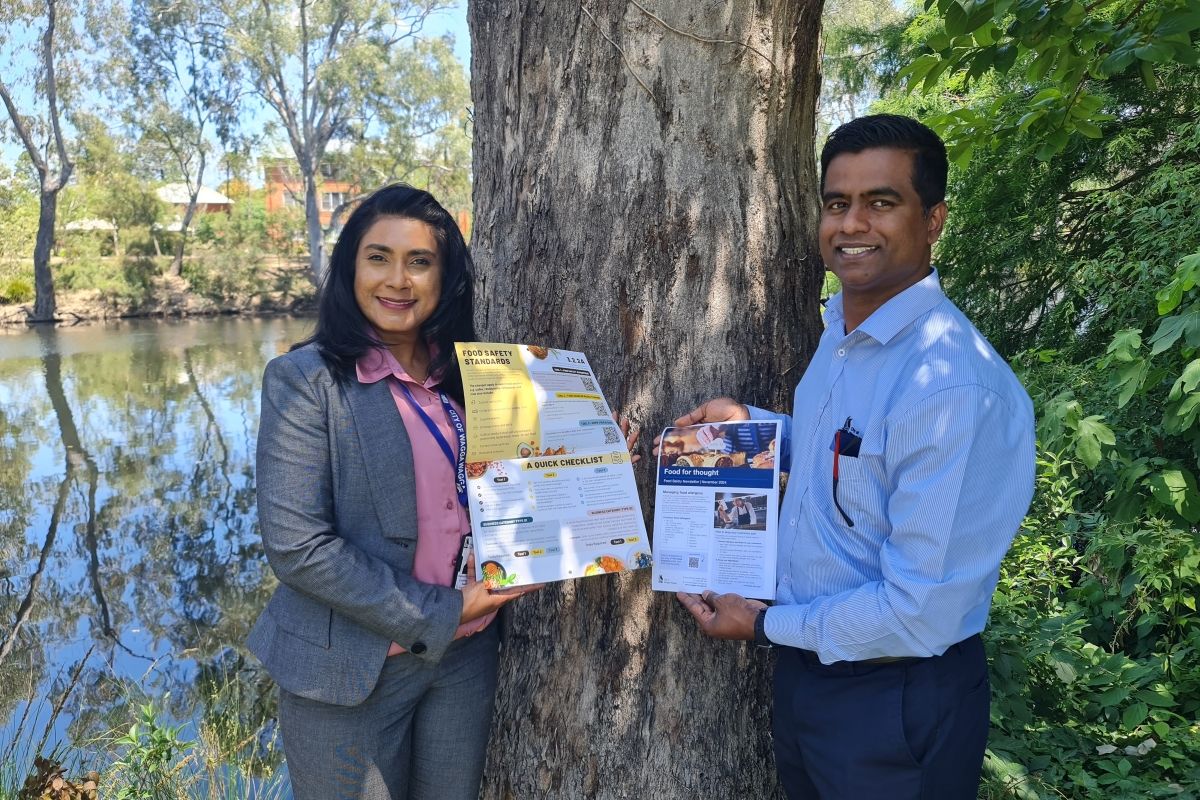 Environmental Health Coordinator Sharomi Dayanand and Environmental Health Officer Uvindu Warnakulasooriya displaying some of the material produced to educate local food businesses about new food safety requirements coming into effect 8 December 2024..