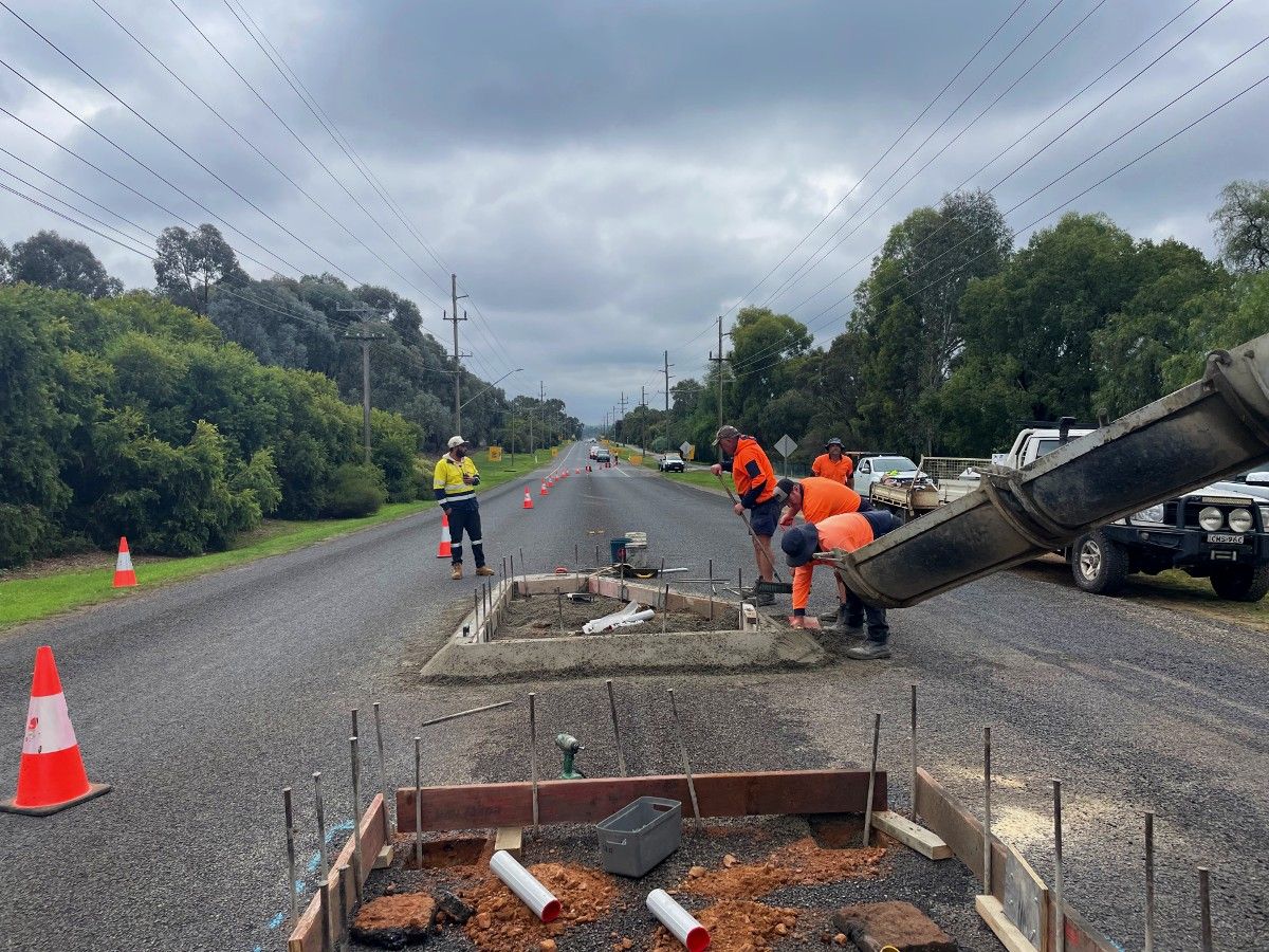 Construction workers building pedestrian refuge