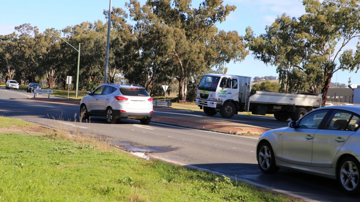 cars approaching roundabout