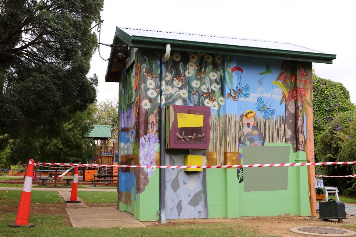 colourful mural on wastewater pump station in park