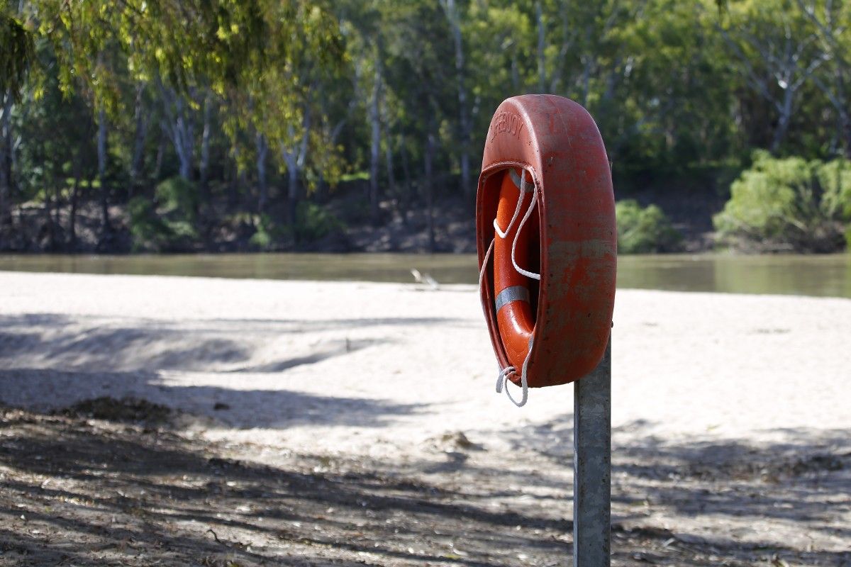 Life buoy in foreground with Wagga Beach and river in background