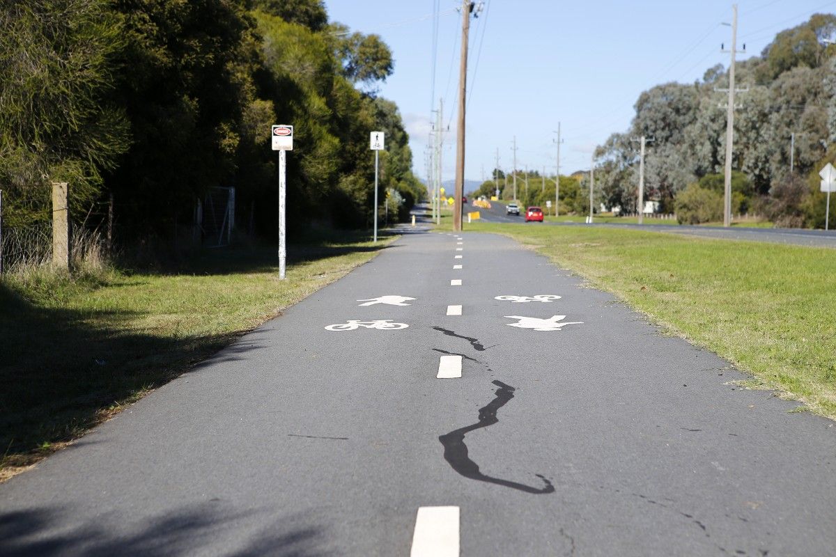 Crack sealing marks on asphalt shared path