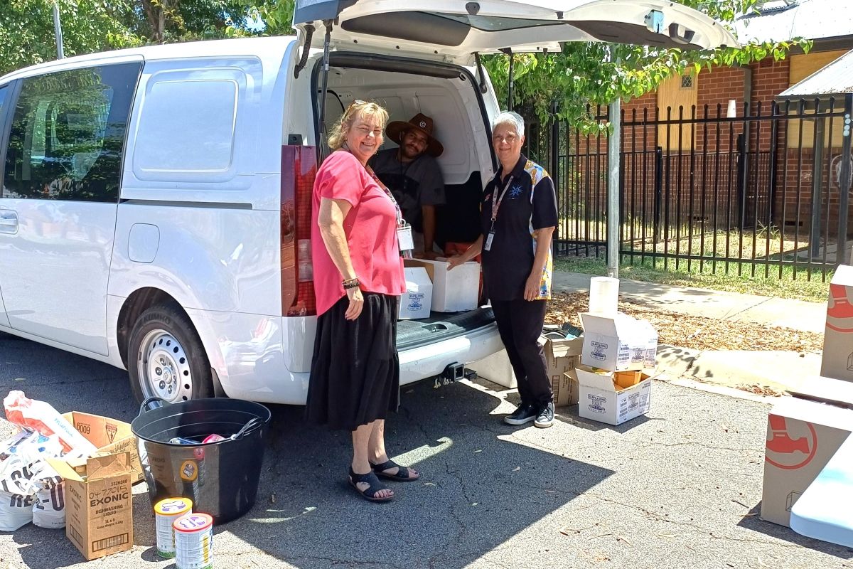 Homes NSW Senior Client Service Officer Cath Parmenter, Trainee Aboriginal Community Development Officer Caleb-Aaron Atkinson, and Homes NSW Senior Client Service Officer Aboriginal Specialist Bronwyn Lyons working at making hampers for the 2024-25 Library Xmas Food Appeal