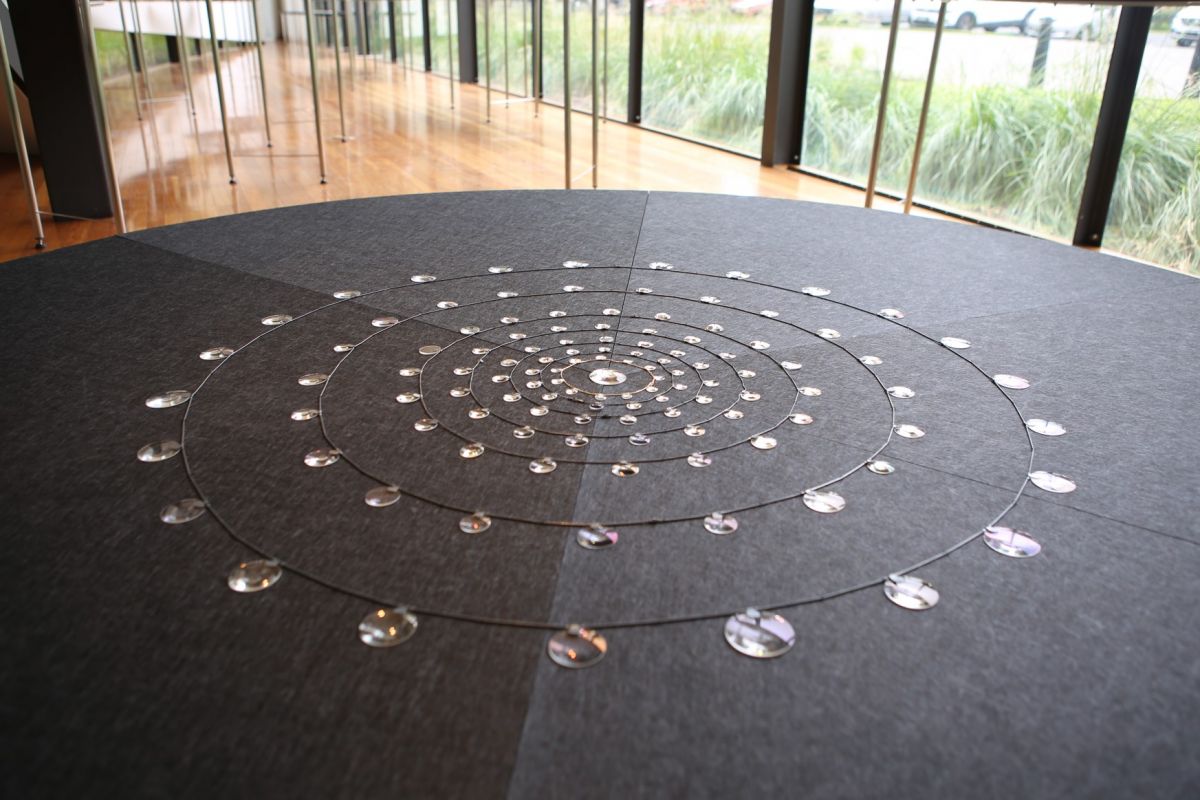 Seven necklaces  of salvaged glass lenses, oxidised sterling silver