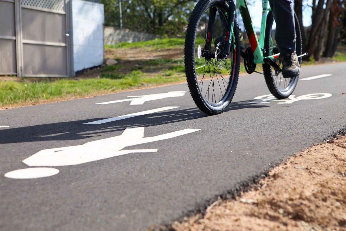 Close up of bike and rider's feet as being ridden on shared pathway