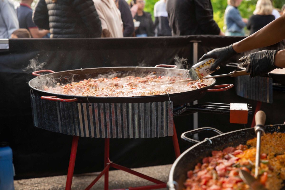 Paella being cooked at street food stall
