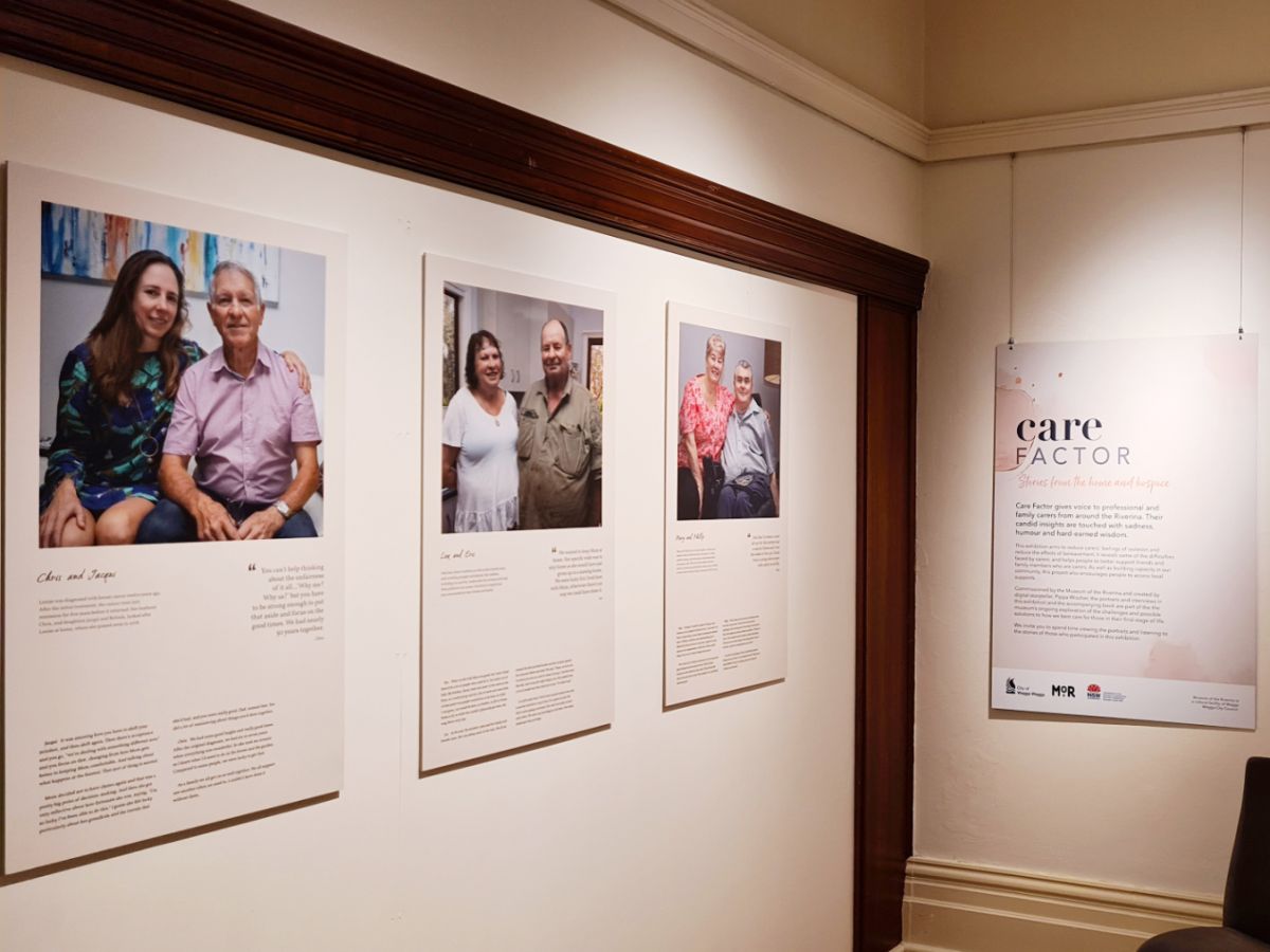 Exhibition portraits on wall, exhibition name sign