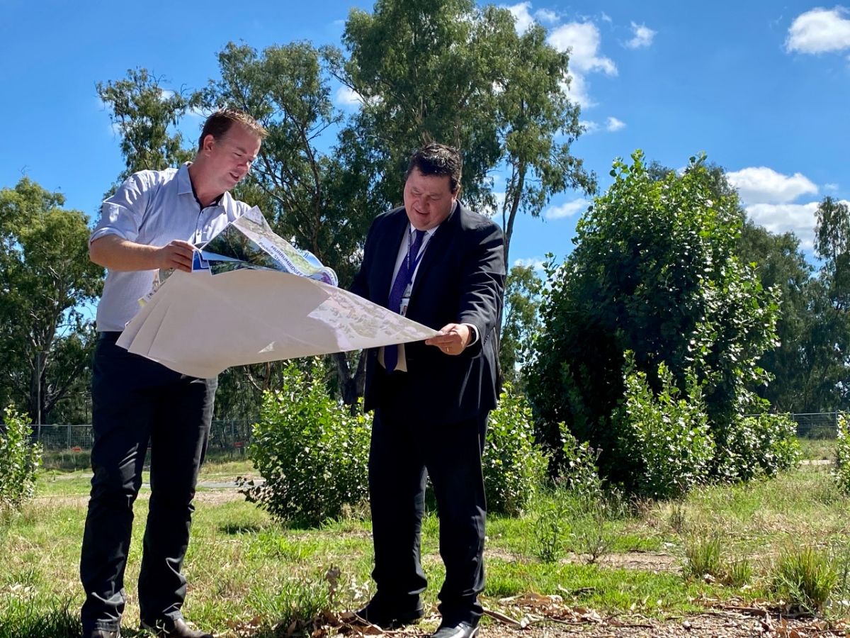 Two men looking at plans