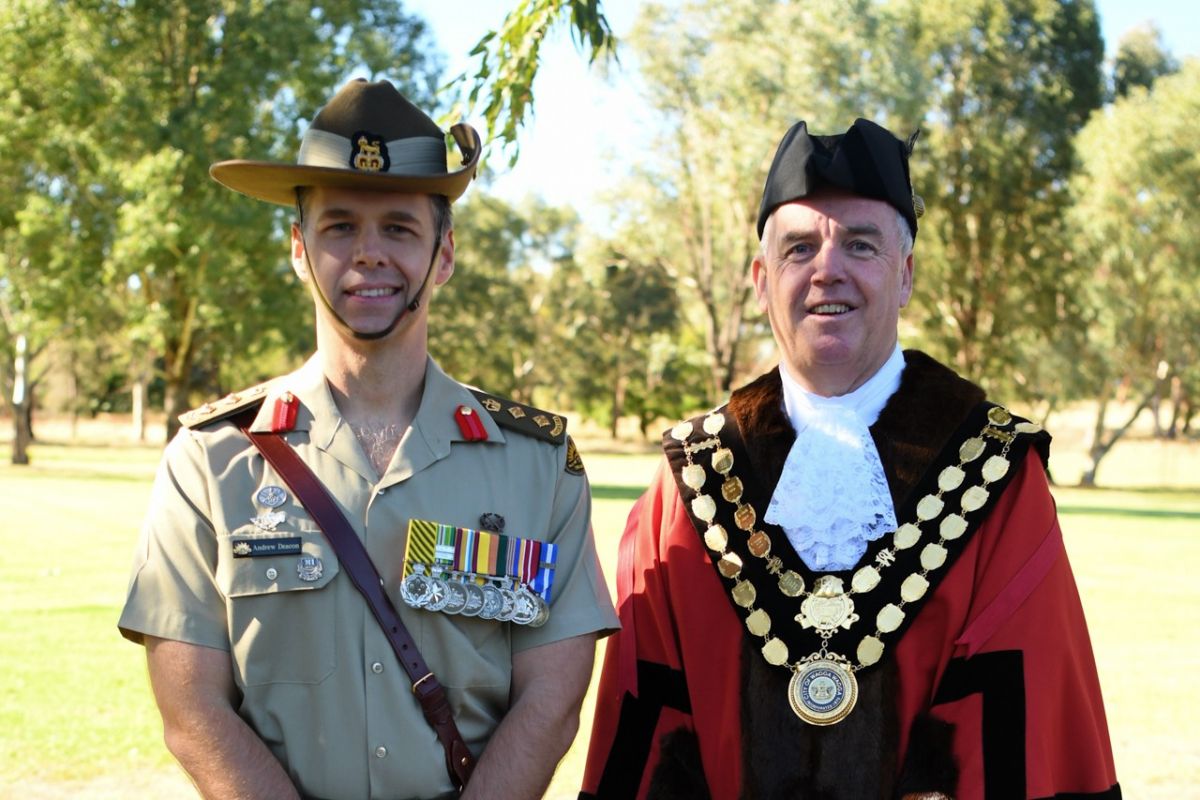 Senior Army officer in uniform next to man in mayoral robes