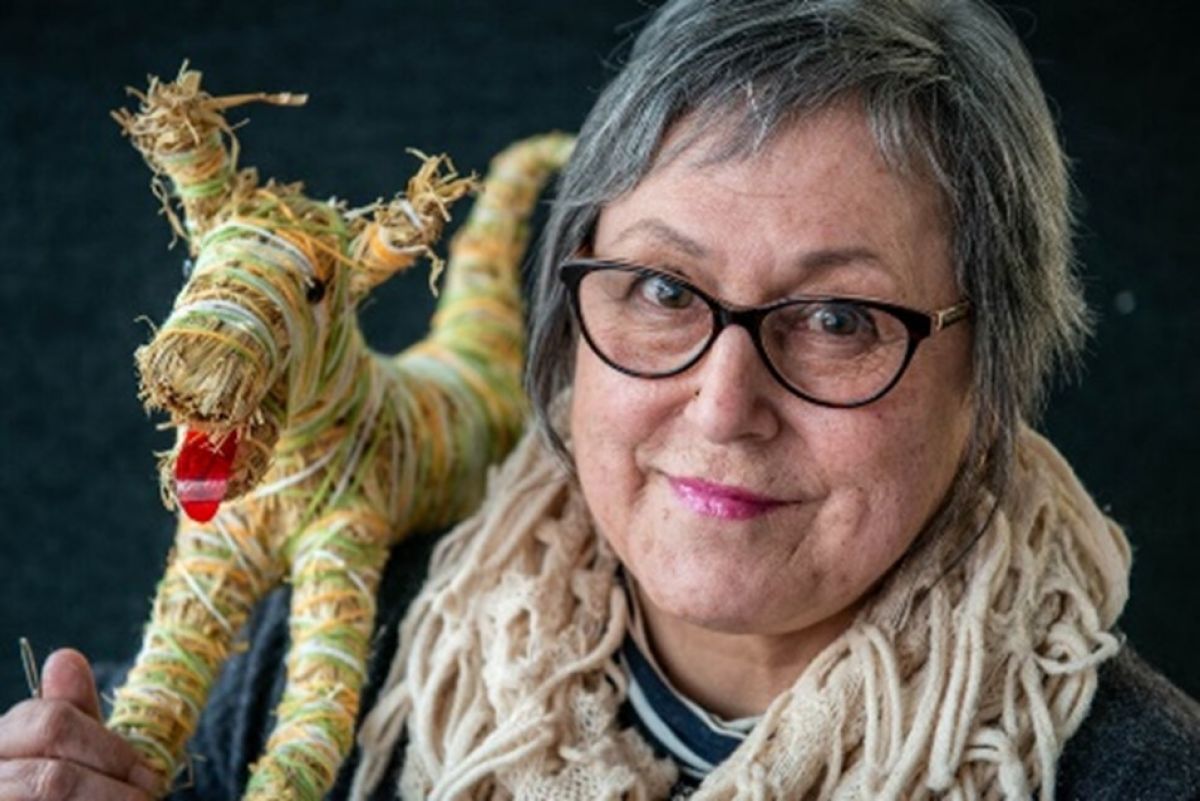 Gunditjmara Artist & Master Weaver Brownyn Razeem with one of her creatiions