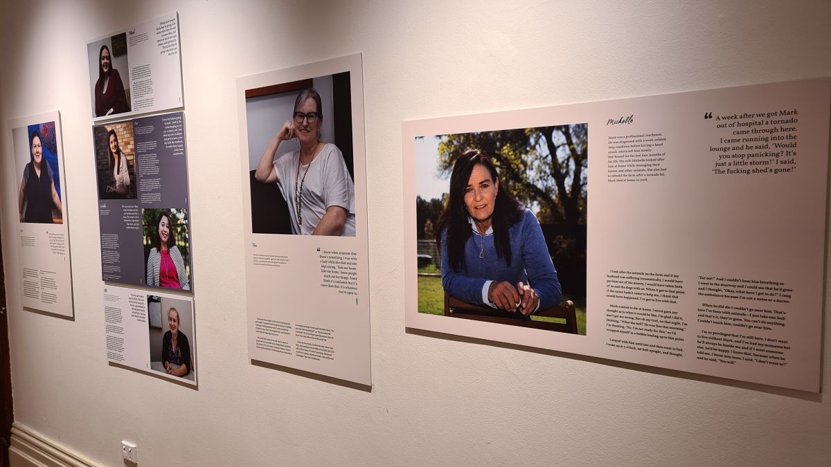 portraits of people hanging on museum all