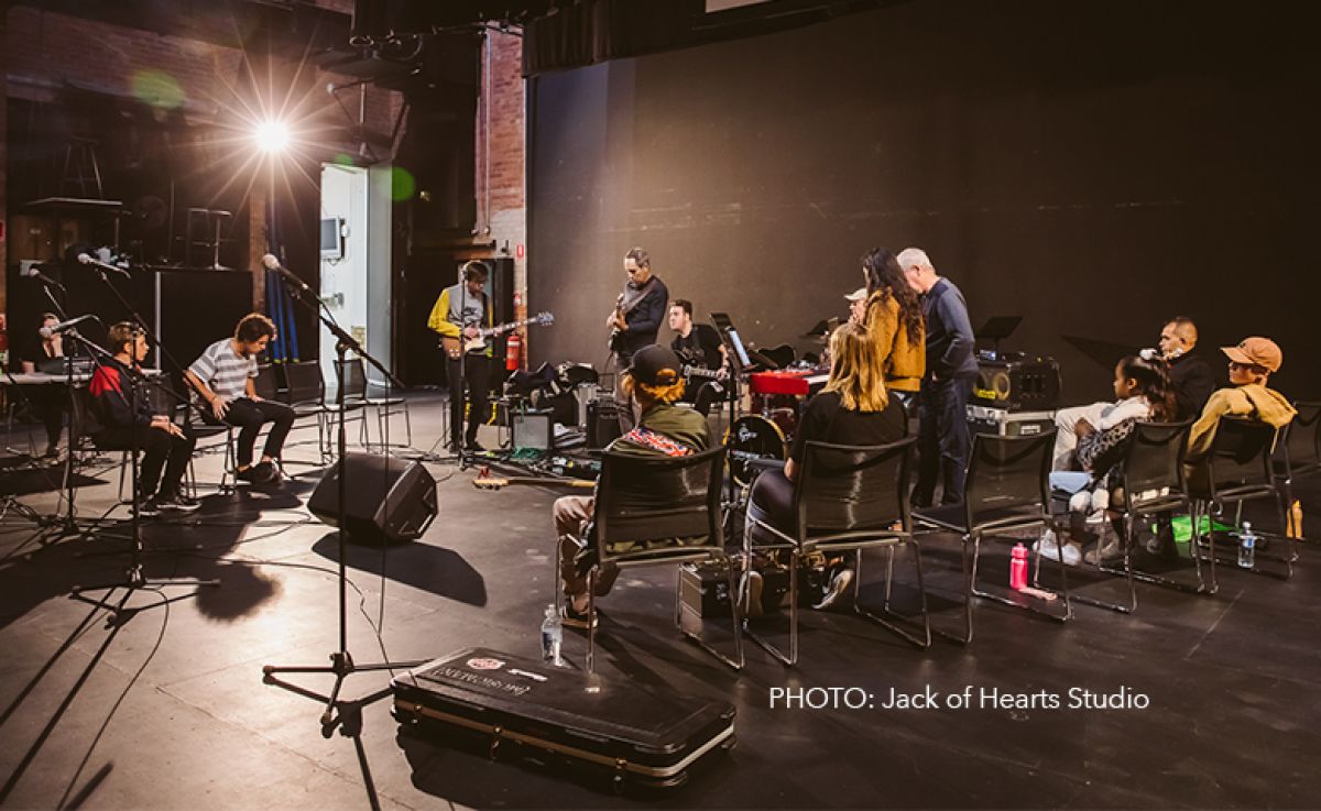 Old and young musicians on stage