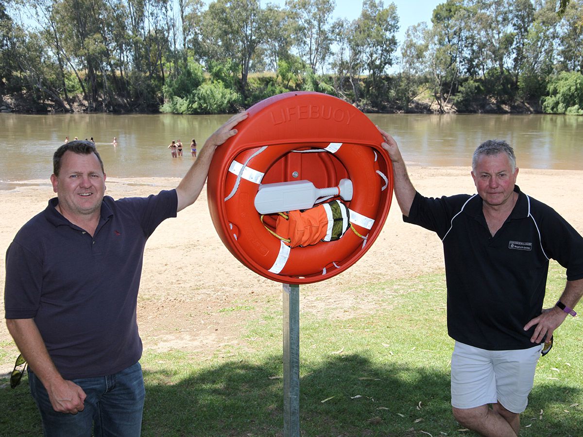Council’s Strategic Recreation Officer Peter Cook (left) and Royal Life Saving NSW Riverina Regional Manager Mick Dasey with one of the new lifebuoy devices installed at Wagga Wagga Beach this week.