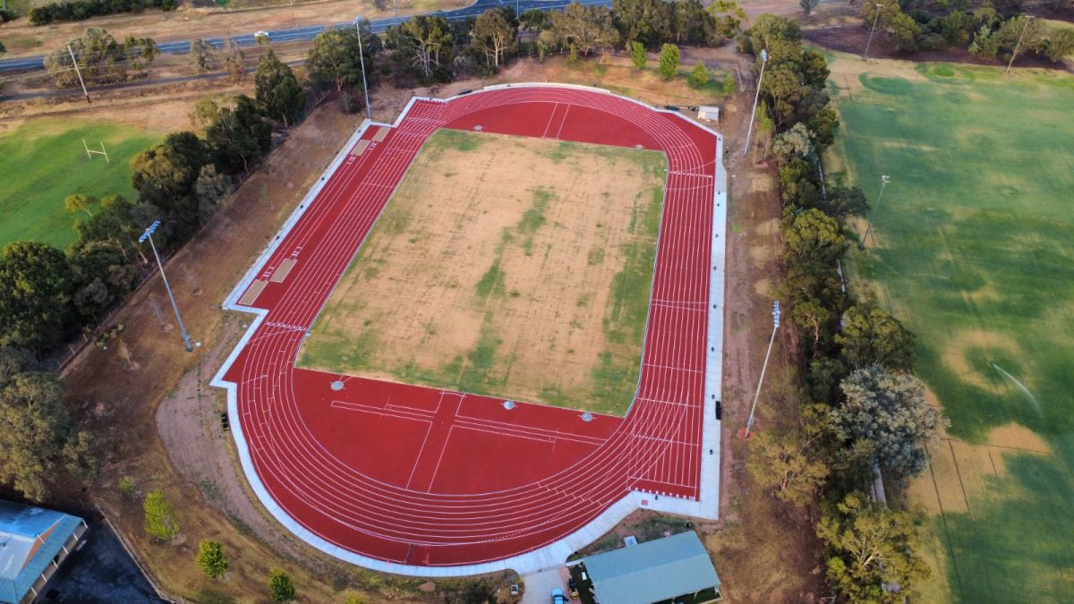 A new athletics track (bright red).