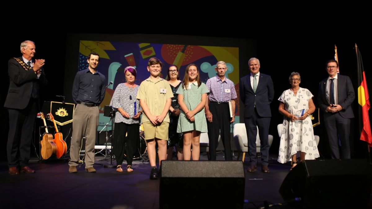 People standing on stage at 2021 Australia Day Awards Ceremony